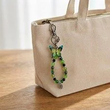 Ensemble bracelet et grigri de sac vert - Aile de mousse